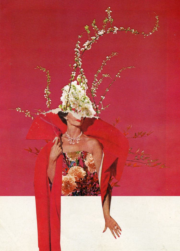 A formally dressed and bejeweled woman with a hairstyle of climbing roses poses against a red background.