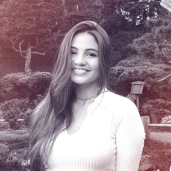 A photographic profile portrait of a young woman facing the camera.
