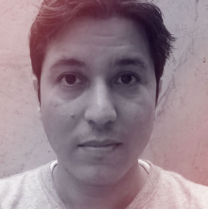 A photographic profile portrait of a young man facing the camera.