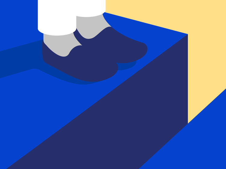 Two feet in gray socks and navy blue shoes align at the rim of a gap formed by the edges two royal blue surfaces.
