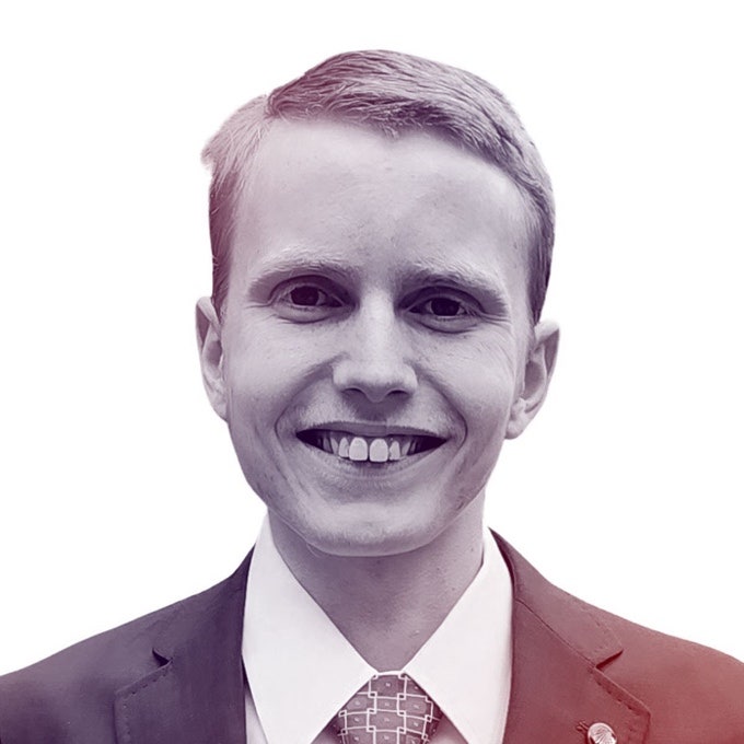 A photograhic profile portrait of a young man facing the camera.