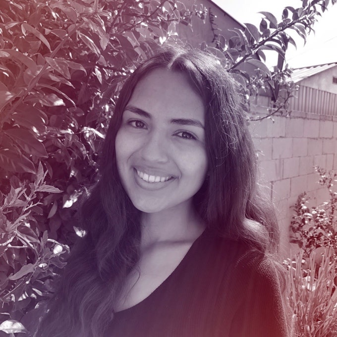 A photograhic profile portrait of a young woman facing the camera.