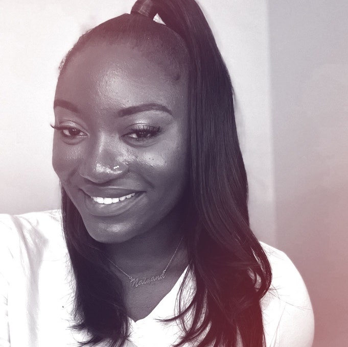 A photograhic profile portrait of a young woman facing the camera.