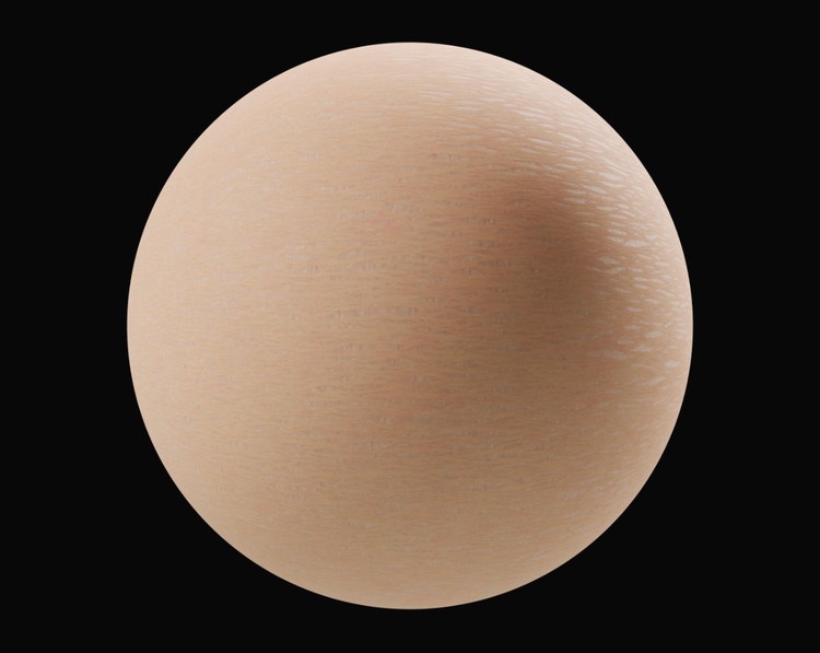 Close-up of a smooth, beige sphere with subtle skin-like surface texture, set against a black background.