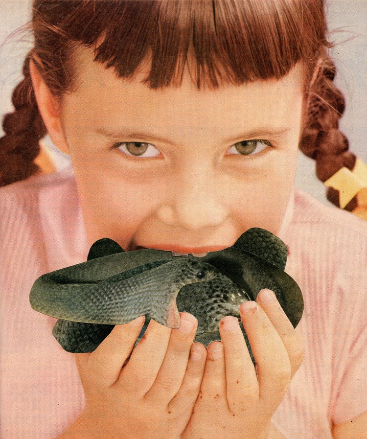 A young girl with braided hair and bangs looks straight at the camera while biting into a coiled up snake in her hands.