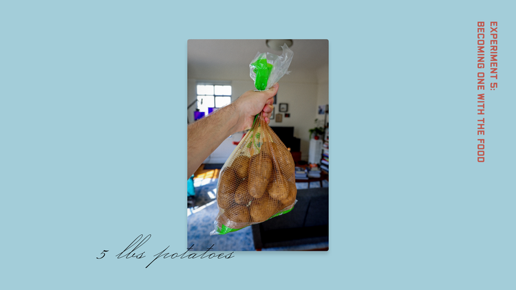 A photograph on a light blue background. An extended arm with a hand holding a five-pound bag of raw potatoes.