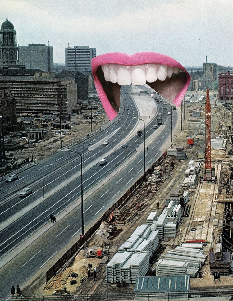 An open mouth bites down on a multi-lane highway running through the middle of a city under construction.