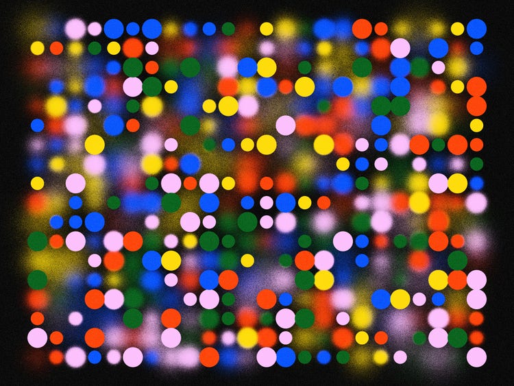 Random pink, blue, red, green, and yellow dots, of varying sizes and resolution on a black background.